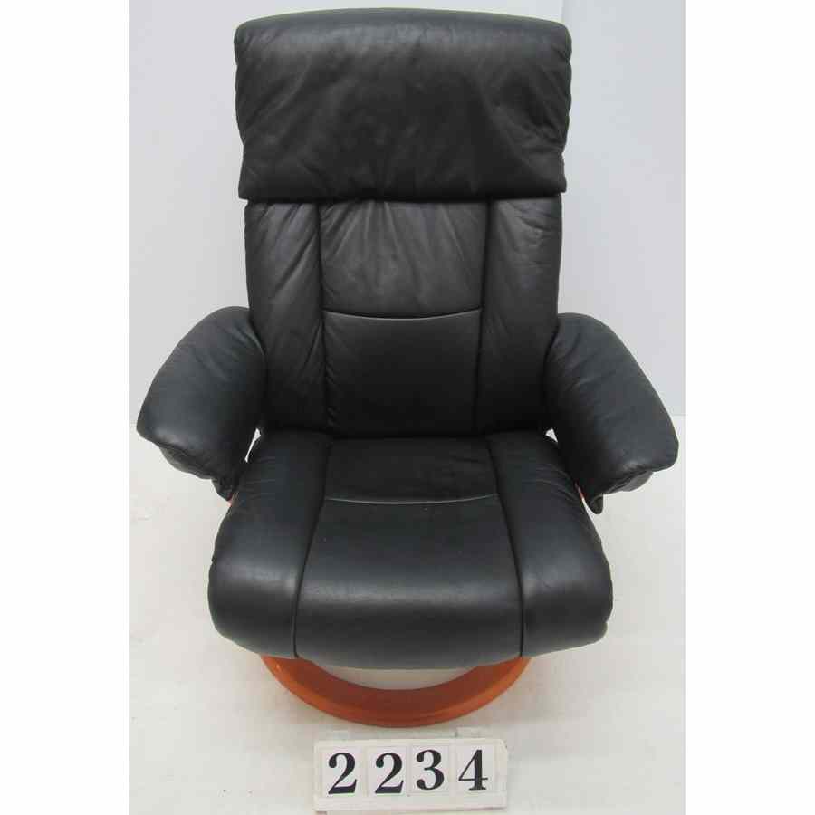 Reclining armchair with footstool.