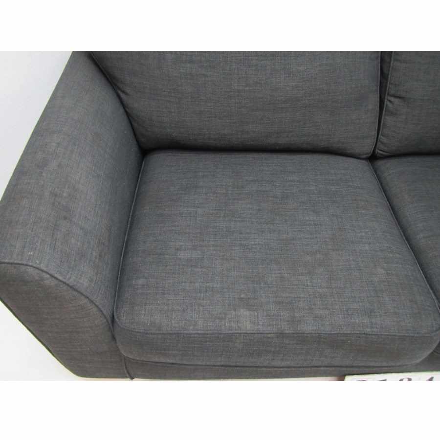 Grey sofa, needs deep cleaning.