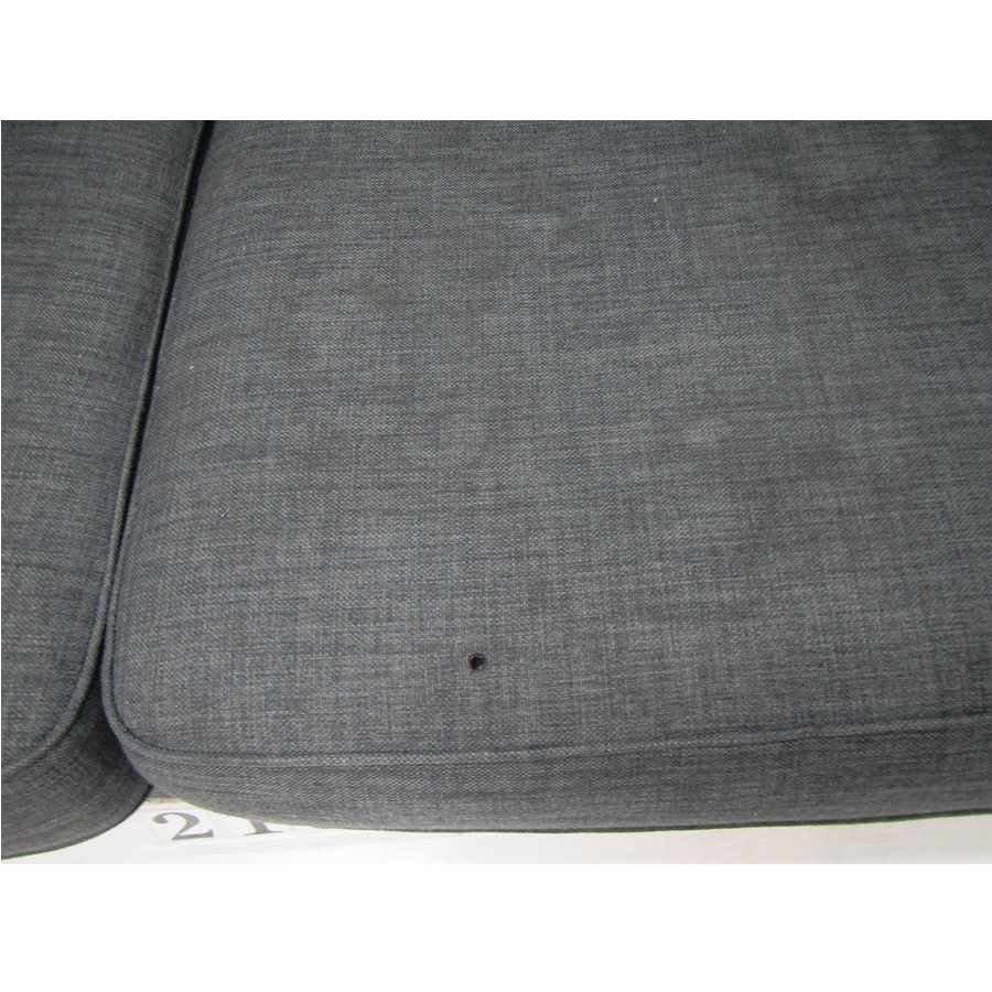Grey sofa, needs deep cleaning.