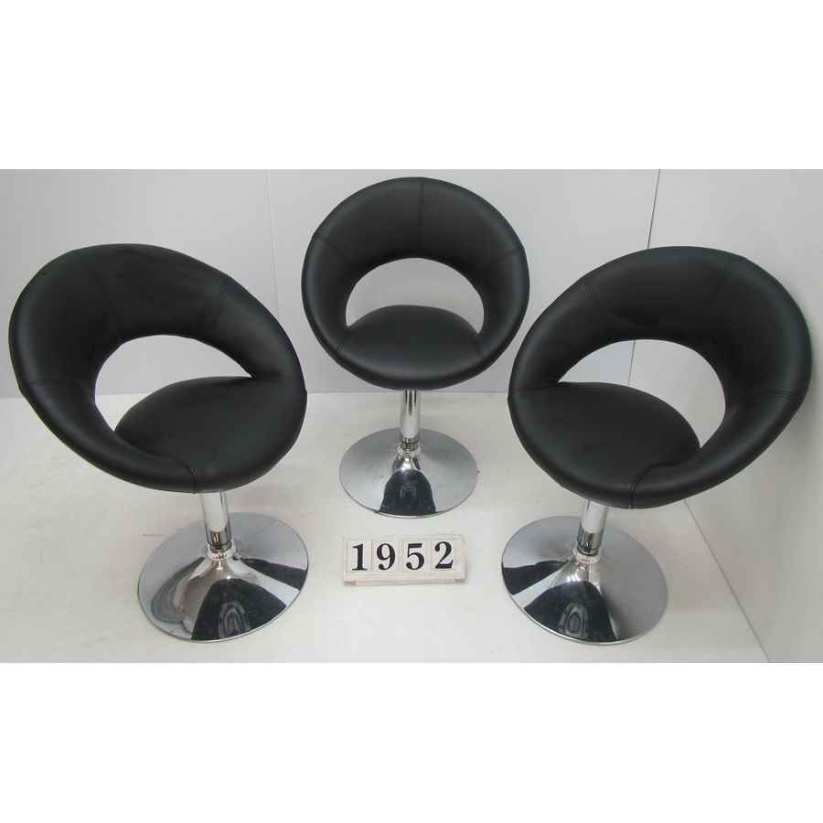 A1952  Set of three low swivel stools.
