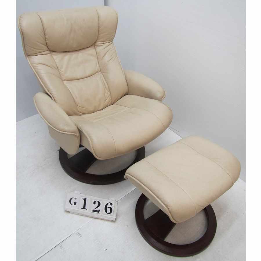 Leather recliner armchair with footstool.