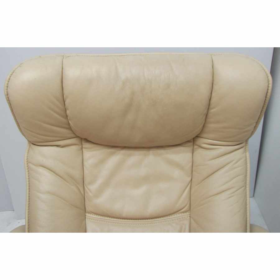 Leather recliner armchair with footstool.
