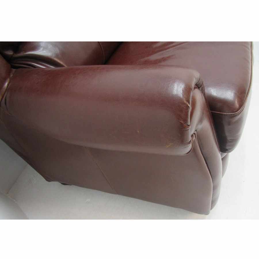 AG134  Leather three seater sofa.