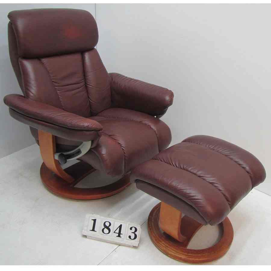 A1843  Leather recliner armchair  with footstool.