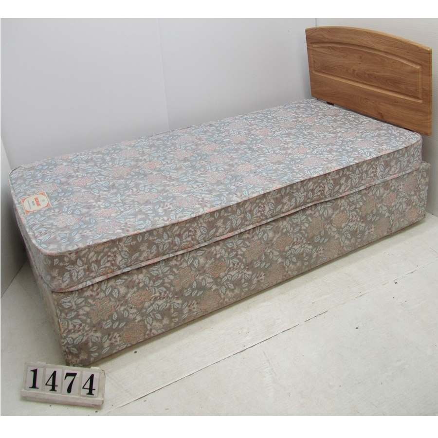 Au1474  Single bed and mattress with headboard.