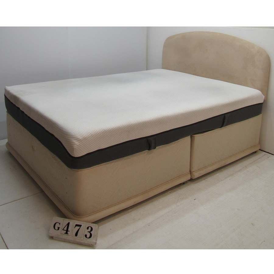Kingsize bed with headboard and mattress.