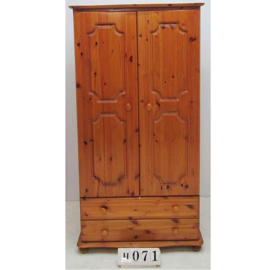 AH071  Solid pine wardrobe with drawers.