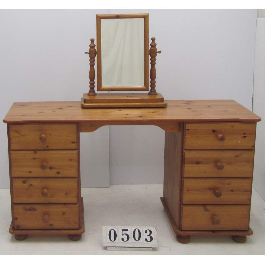 Dressing table with drawers and mirror.
