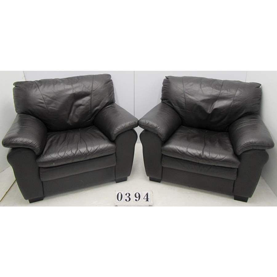 Pair of brown leather armchairs.