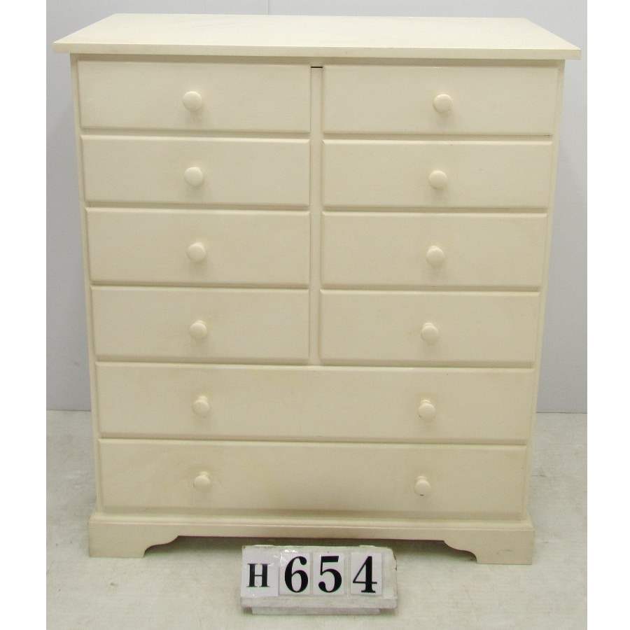 Cream chest of drawers.